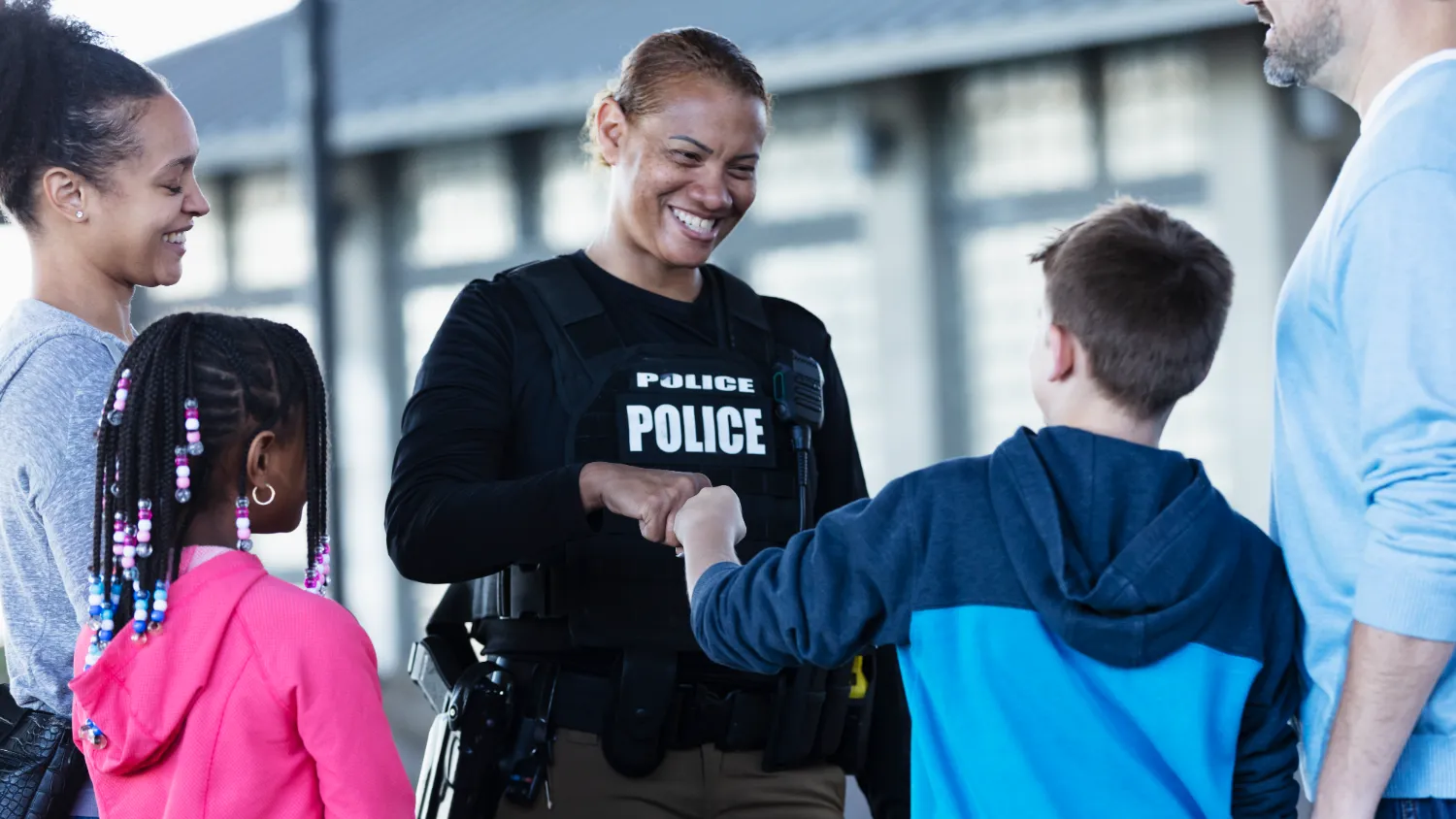 Female police officer with children Female police officer with children