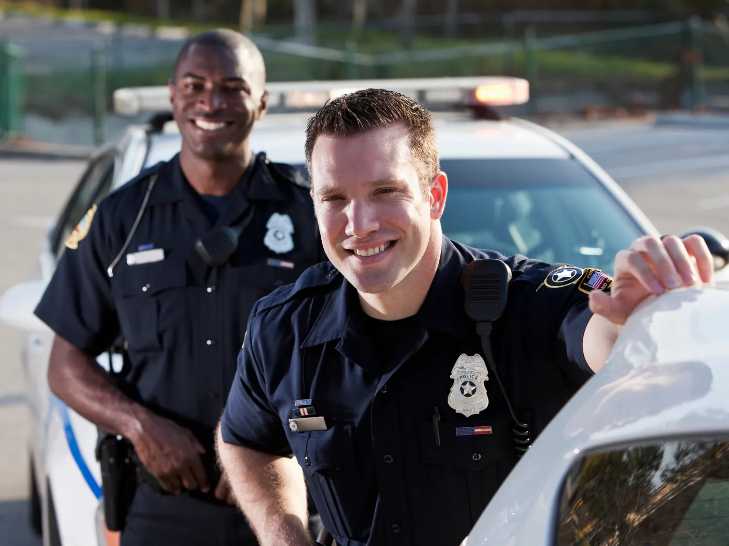 smiling officers Police talking with a small kid